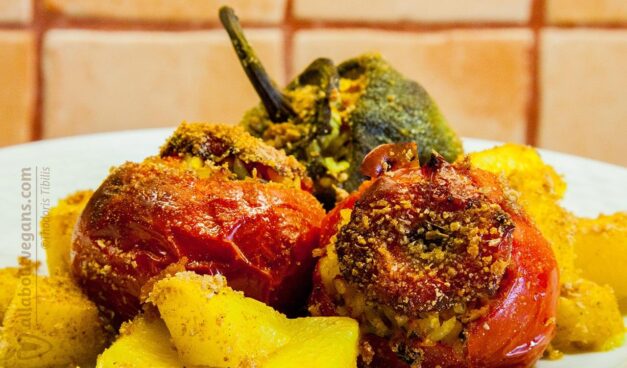 Vegan Greek "gemista". Stuffed tomatoes and green bell peppers with rice, veggies, herbs and spices