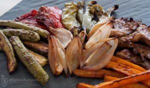 Photo of roasted marinated vegetables (mushrooms, onion, zucchini, carrots and peppers. A vegan and vegetarian recipe from All About Vegans.