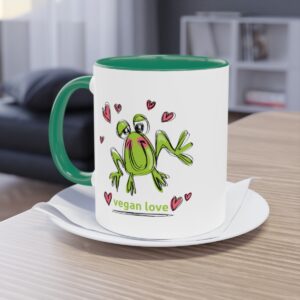 Photo of tea/coffee mug with cartoon frog design and vegan love message. All About Vegans