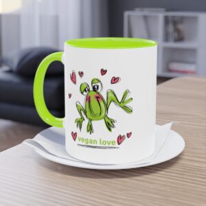 Photo of tea/coffee mug with cartoon frog design and vegan love message. All About Vegans