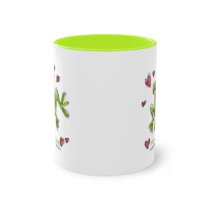 Photo of tea/coffee mug with cartoon frog design and vegan love message. All About Vegans