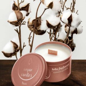 Photo of a white vegan soy candle in a rose gold metal container with a cotton flower scent and a background of cotton flower branches. Quantity 100ml